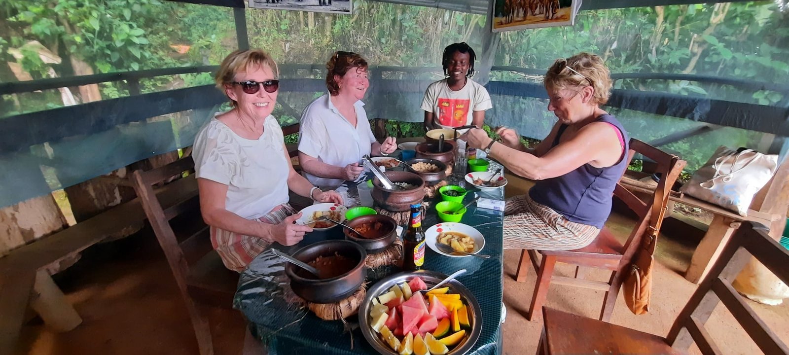 Guests enjoying a local lunch during the Materuni Waterfalls and coffee tour