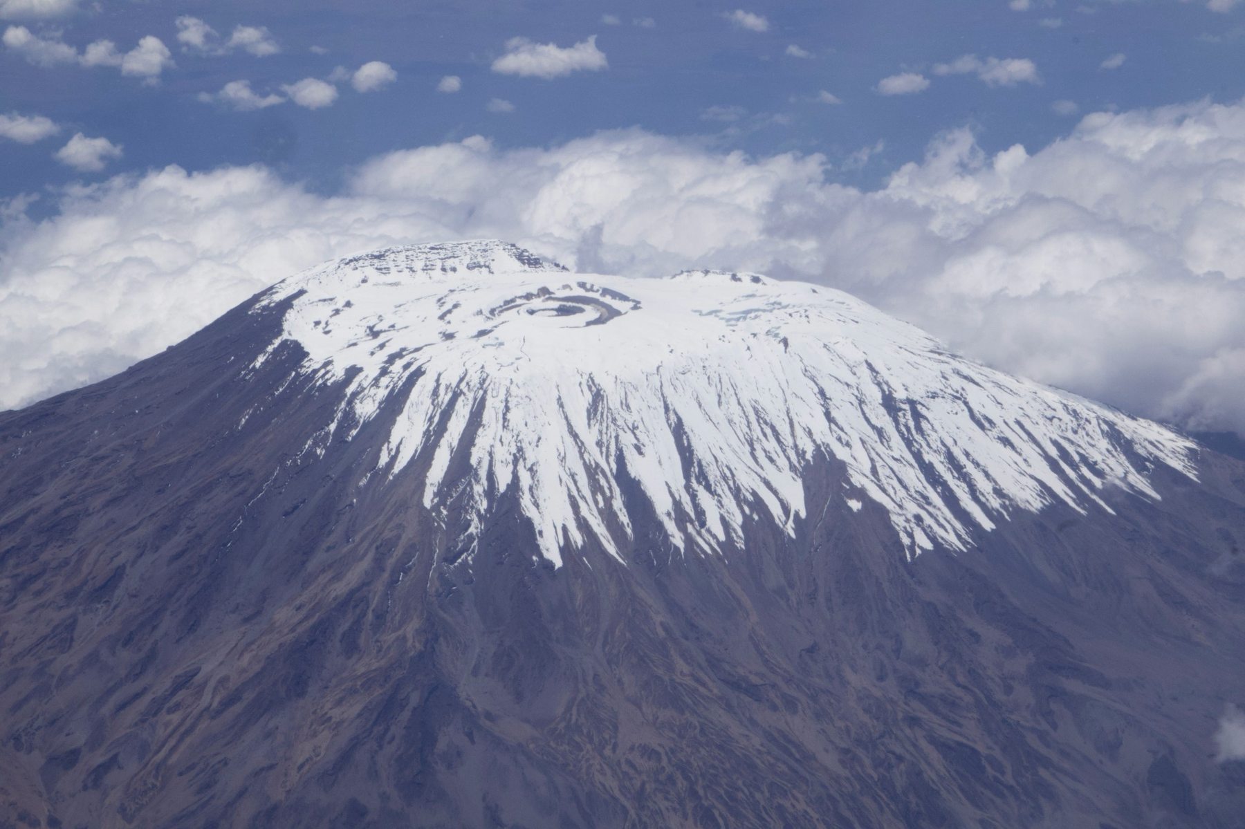 Mount Kilimanjaro snow-capped summit under clear blue skies