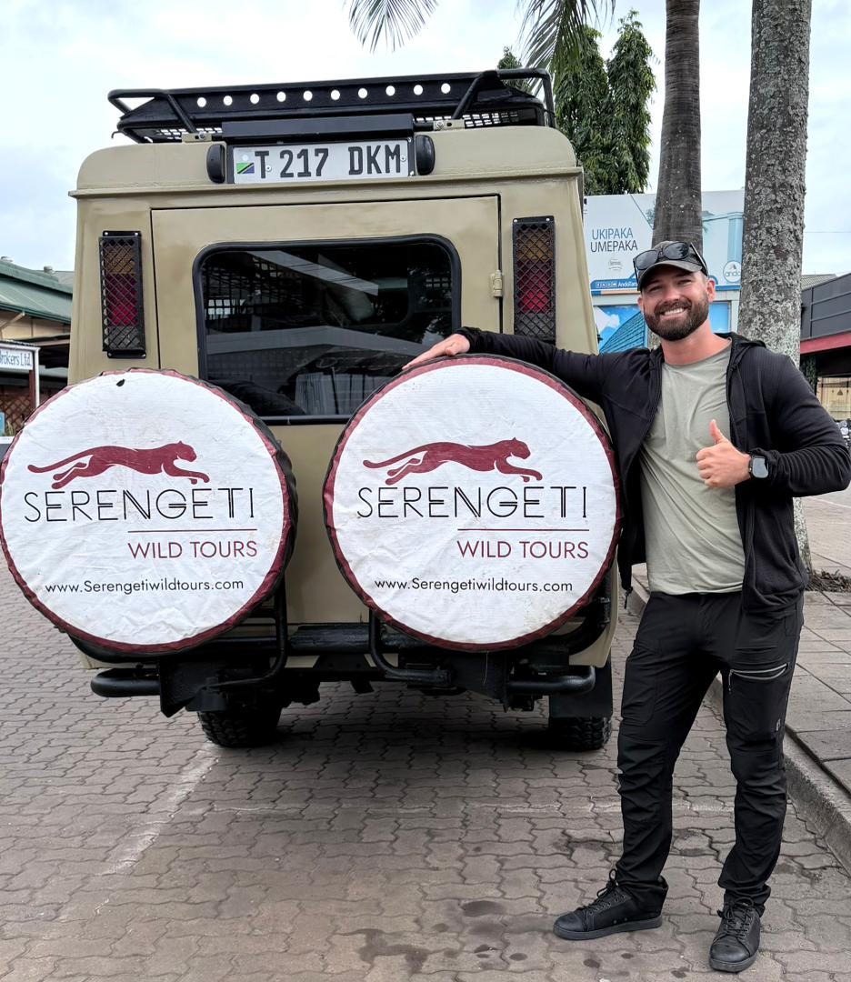 Solo traveler on a Serengeti safari game drive in Tanzania